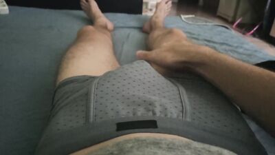 The boy touches his young cock.