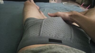 The boy touches his young cock.