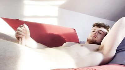 Solo male jerking his big cock on the couch