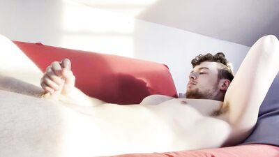 Solo male jerking his big cock on the couch