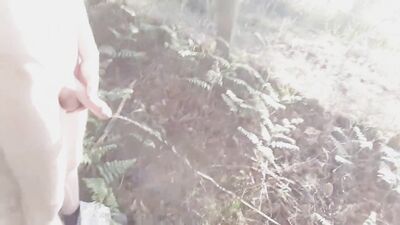 Big dick twink pissing in the woods