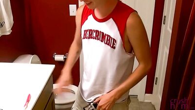 Tattooed twink is on the bathroom floor while jerking off