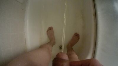 Teen boy urinating uncut penis