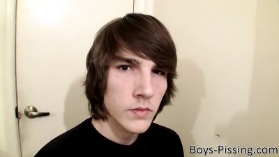 Smooth and beefy twink masturbates and pisses in a bathroom