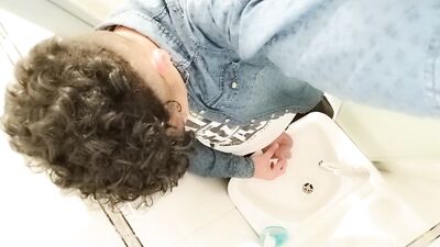 Peeing to the sink with uncut cock