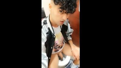 Quick peeing on a public toilet in a sitting position