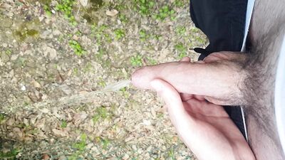 Taking a le*ak in a public park.