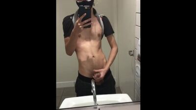 twink jerks off in public bathroom