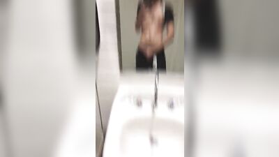 twink jerks off in public bathroom