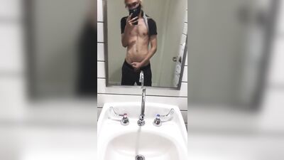 twink jerks off in public bathroom