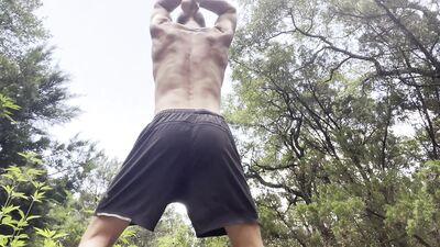 Cam Crest flexes is outside in public.