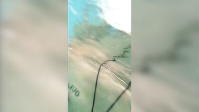Pulling cock of swimtrunks in the public pool ( cock and feet underwater )