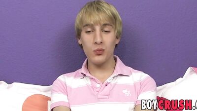 Adorable blonde twink Dean Holland strokes cock and cums
