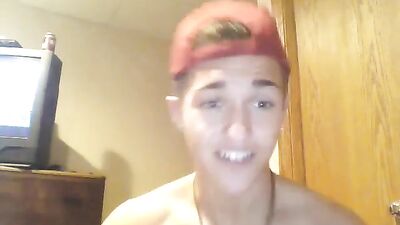 Nice looking boy jerks on his abs