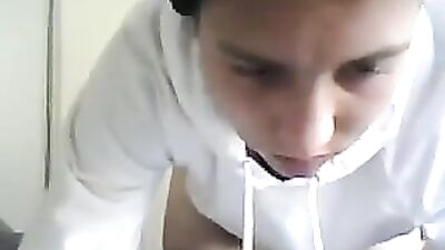 White sweater boy on webcam