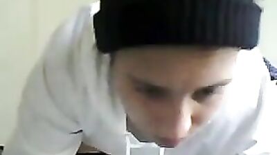 White sweater boy on webcam